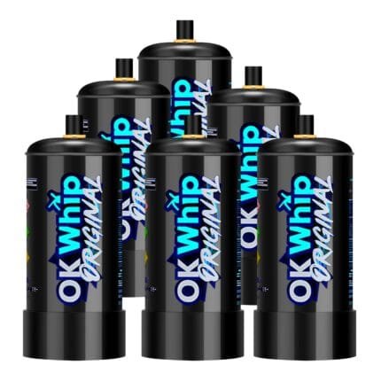 A row of five black OK Whip cream charger cylinders standing together.